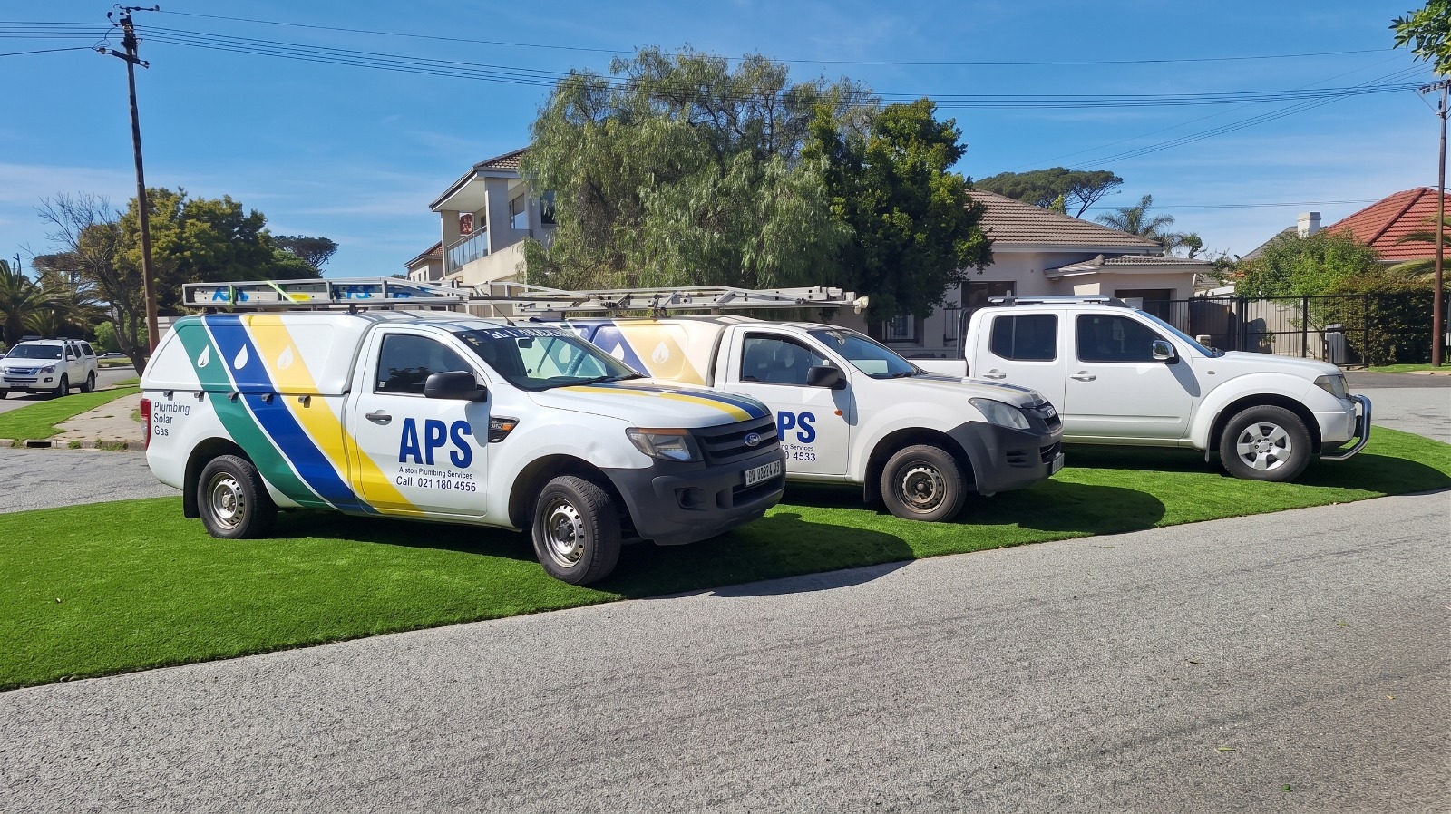 APS Plumbing fleet vehicles — professional plumbing, solar and gas service trucks